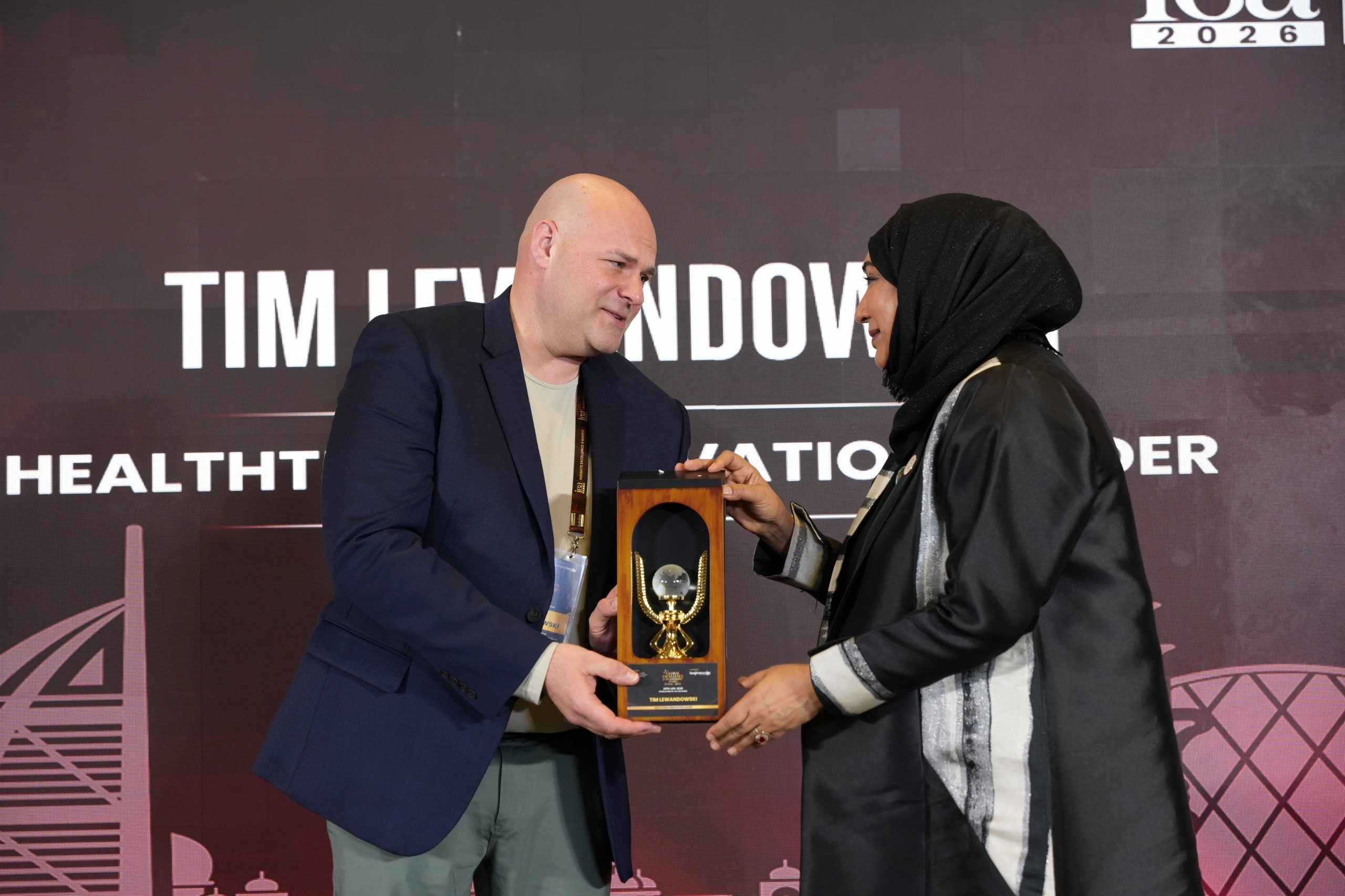 Tim Lewandowski receiving the Healthtech Innovation Leader award at the IEA 2026 Insights Excellence Awards ceremony.
